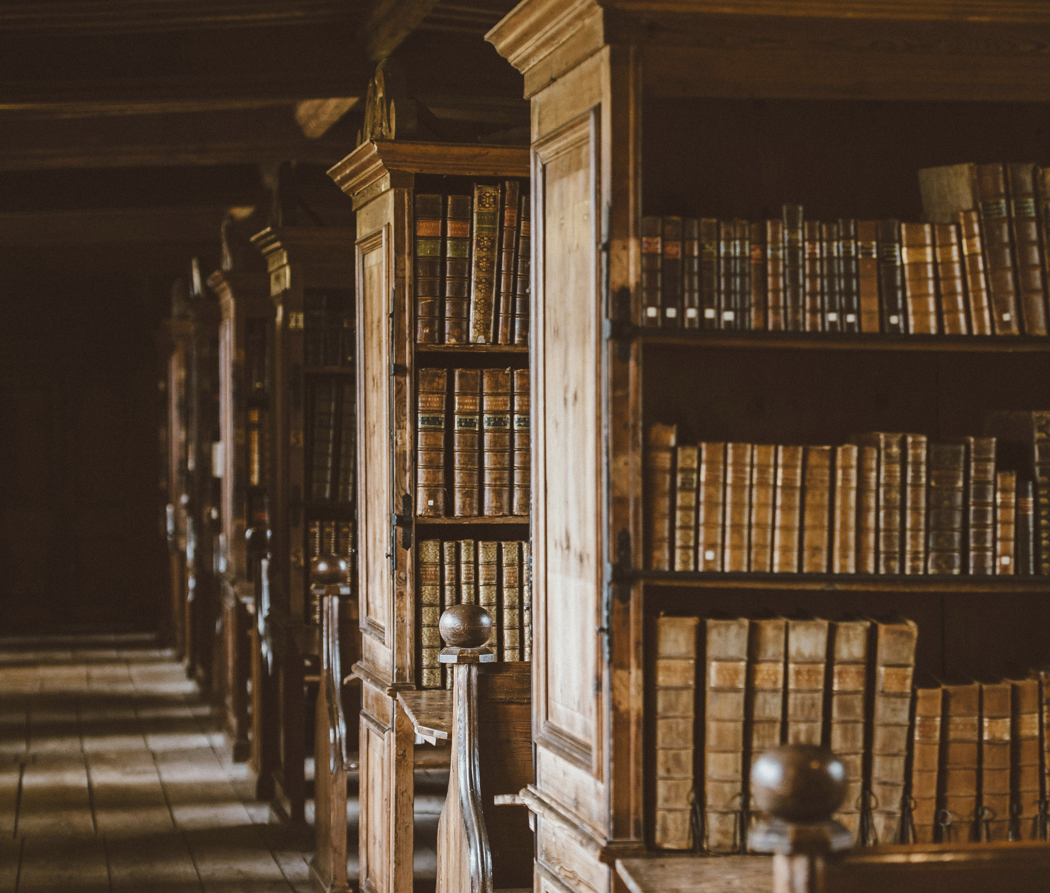 Rows of old books in a library